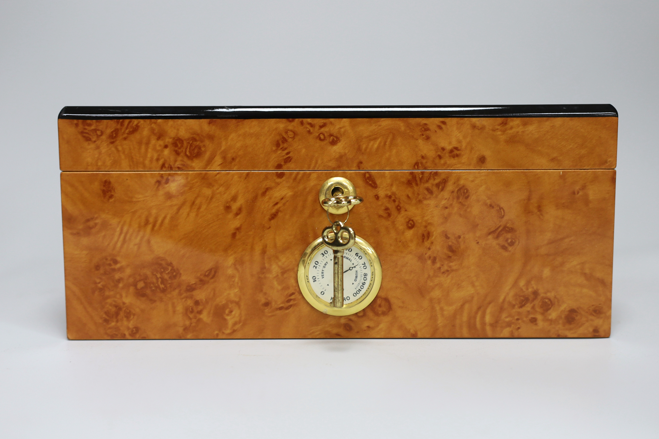 A thuya wood humidor with key, 12.5cm high x 29cm wide